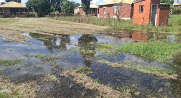 Image of a pool of water caused by a leaking pipe.