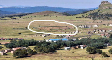 Image of Isandlwana hill with the demarcation of a the construction of a hall.