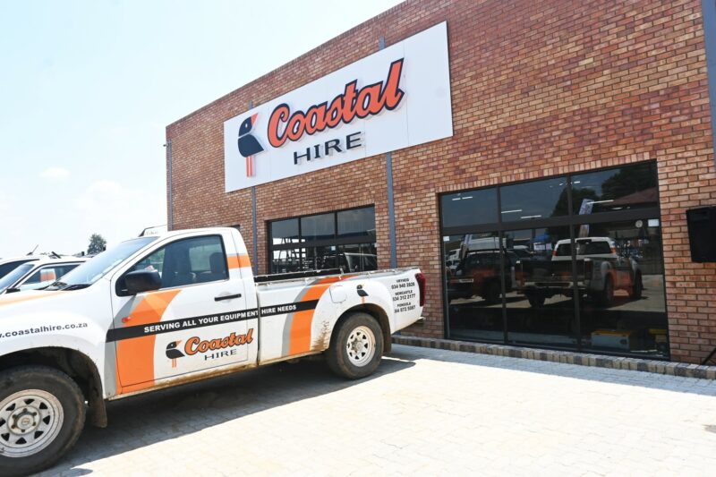 A photo of a business workshop filled with heavy machinery tools and vehicles.