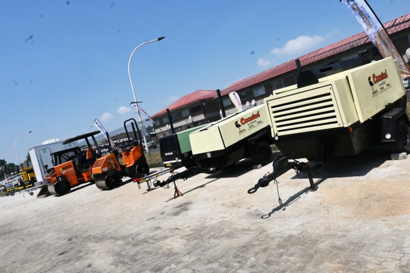 A photo of a business workshop filled with heavy machinery tools and vehicles.