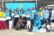 Image of blue clad community SAPS patrollers (volunteers) with Umzinyathi SAPS management.