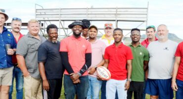 Image showing group of Sentraal rugby players in Glencoe next to the field with a ball.