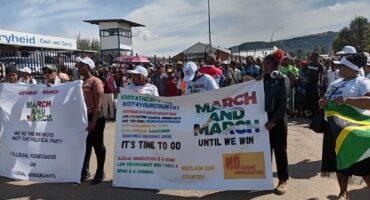 An image of AbaQulusi residents holding placards during a march against illegal immigrants, crime and compliance in the Vryheid CBD.