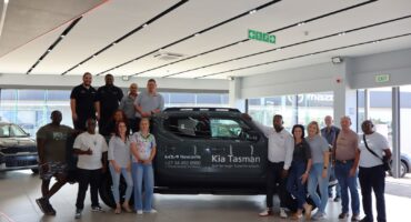 Staff and guests pose with the new Kia Tasman bakkie at MMG Kia Newcastle showroom