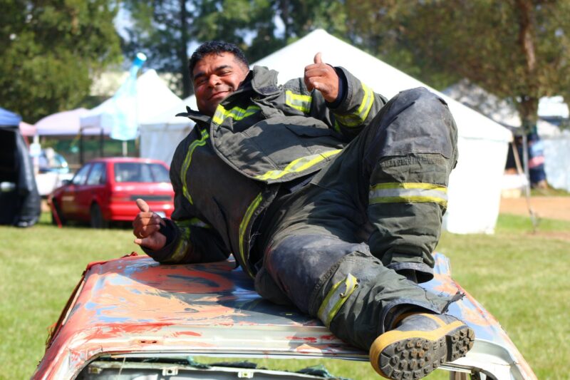 A local firefighter gives the thumbs up while he chills on car used for demonstration purposes.