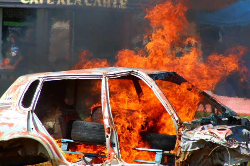 A vehicle is pictured while it's on fire.
