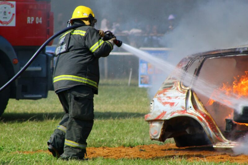 A fire fighter is pictured doing a demonstration on how they put out a fire.