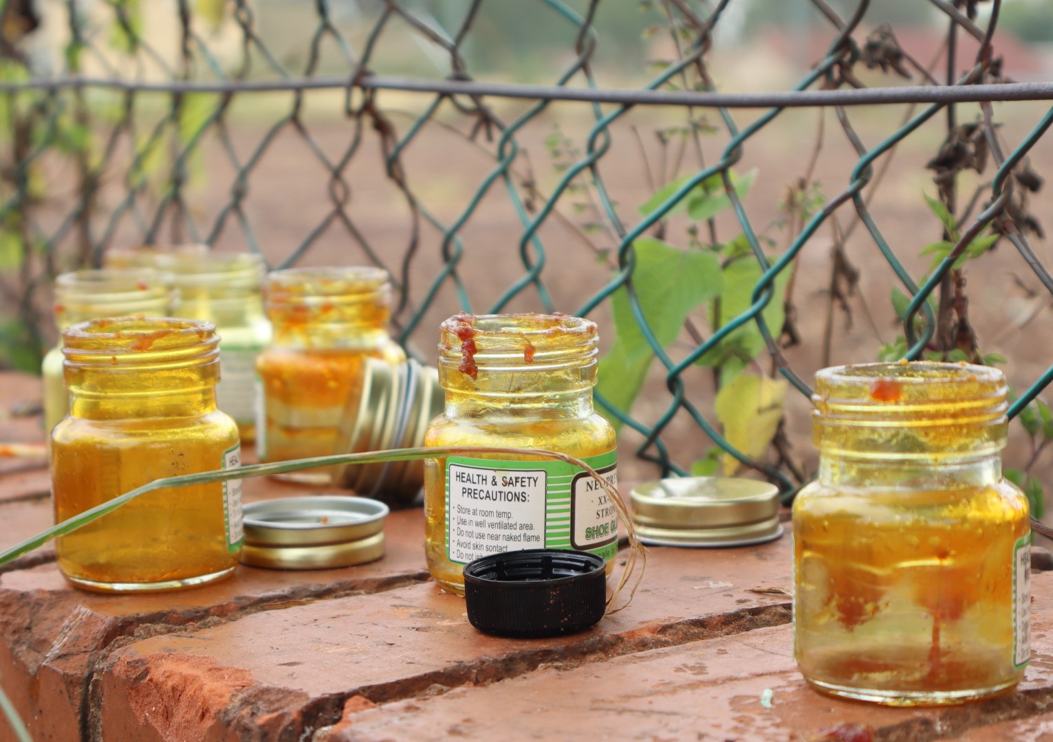 Bottles of shoe glue is photographed being scattered around the Fairleigh tennis courts.