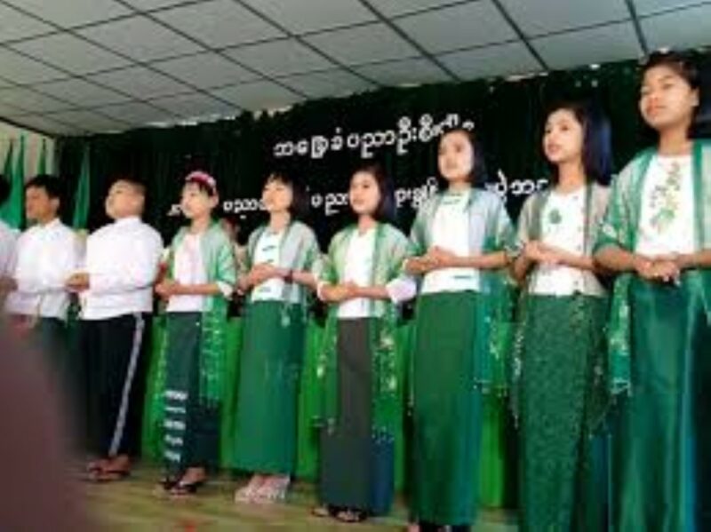 Students in a line with their traditional school wear.