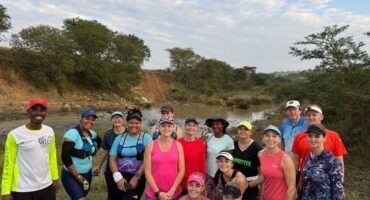 Image of group of runners posing after a farm run.