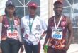 Image of runners from Vryheid Athletic Club after a race with their medals.