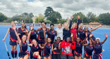 A photo taken on a hockey field of the Volksrust High School's Under 16 Girls Hockey team.