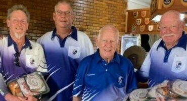 Four Newcastle bowlers pose with their trophy's for a photo.