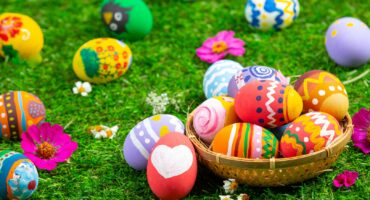 colorful Easter eggs photographed on green grass