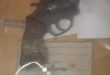 Image of a .38 Special revolver along with ammunition on a table in plastic.
