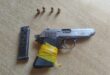 Image of a pistol with a magazine and ammunition/