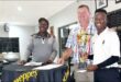 Image of Jo Khumalo of the Dundee Golf Club congratulating Battlefields tournament winner Lusanda Zondi, along with club captain Hammie Meintjies.