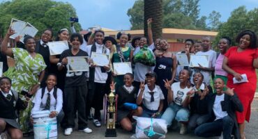 Group of ML Sultan learners and educators at the school holding certificates.