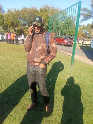 Image of Sandile Khanyendi, MK spokesperson in Dundee talking on his cellphone.