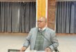 An image of AbaQulusi Local Municipality Mayor, speaking on a microphone at Cecil Emmett Hall where he presented the 2026/27 IDP and draft budget to the residents of wards 8,9 and 10.