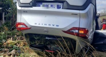 Image of vehicle on its roof.