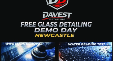 A black poster with bold white and yellow writing and several images of car detailing.