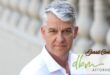 A professional portrait photo taken of a grey-heaired man. The DBM Attorneys logo is written in bold light green and the man's name, Gerrit Coetzee is written in bold black writing.