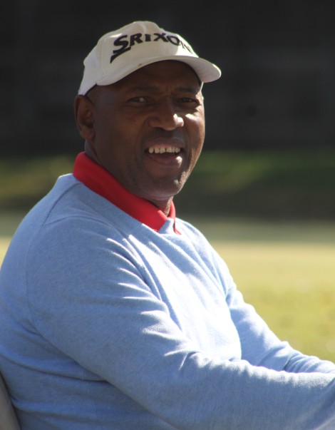 A golfer is photographed in action on the greens.