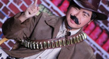 A young man dressed up as General Botha in his war atire during a school play.