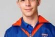 Image of teenager dressed in his school track suit.