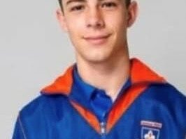Image of teenager dressed in his school track suit.