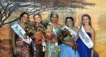 Image of learners dressed in evening wear after a beauty contest.