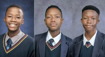 A collage of three photos of three young boys dressed in their school uniforms posing in front of a blue background.