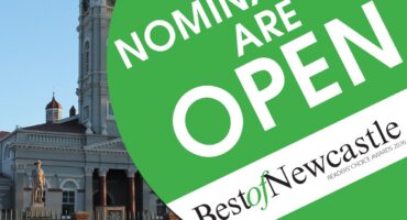 A photo of the Newcastle Town Hall, with a green and white circle with 'Nominations are Open and Best of Newcastle' written in bold text inside it.
