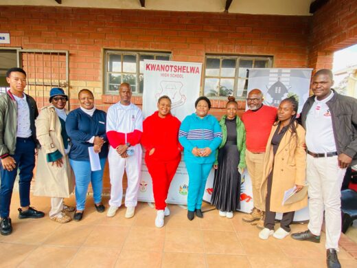 An image of KwaNotshelwa High School stakeholders celebrating the top 10 learners from each grade who have done well in the first-term.