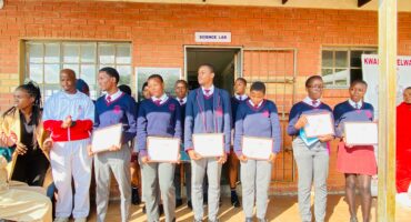 An image of KwaNotshelwa High School learners, holding certificates. They were recently recognised for their outstanding first-term results.