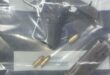 Image of ammunition and a firearm in an evidence bag.