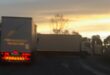 Image of trucks blocking the road, R602, near Glencoe.