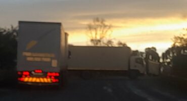Image of trucks blocking the road, R602, near Glencoe.