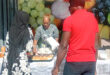 Image of people buying cakes on a table in Glencoe.