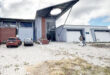 Image of a library near Dannhauser still under construction with vegetation reclaiming the parking lot.