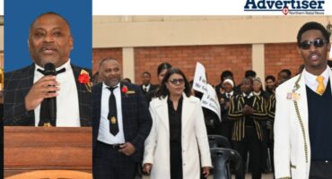 A celebration is photographed inside a school hall, wishing its school principal farewell.