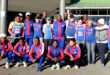 Image of BBAC runners in club colours in front of the Dundee Wimpy.
