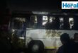 Image of illegal immigrants getting on a bus at night.