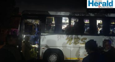 Image of illegal immigrants getting on a bus at night.