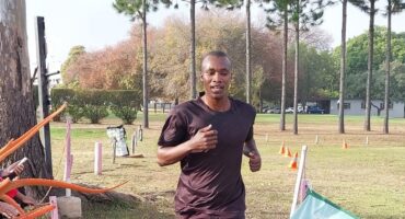Image of a man running towards a finish line.