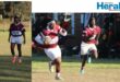 Image of rugby players running with ball.