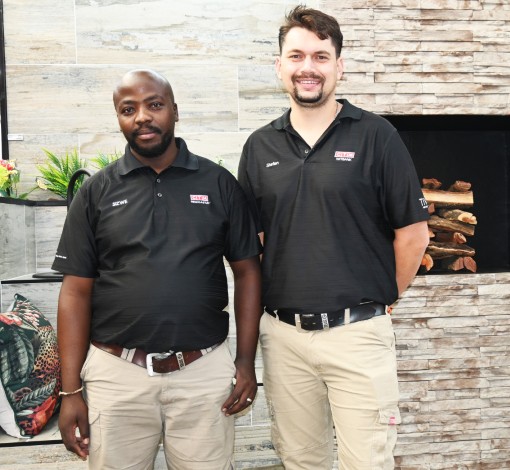 Two men pose inside a newly revamped Newcastle CTM.