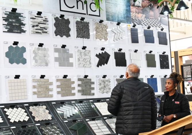 A customer is pictured admiring the different tiles available at CTM Newcastle.