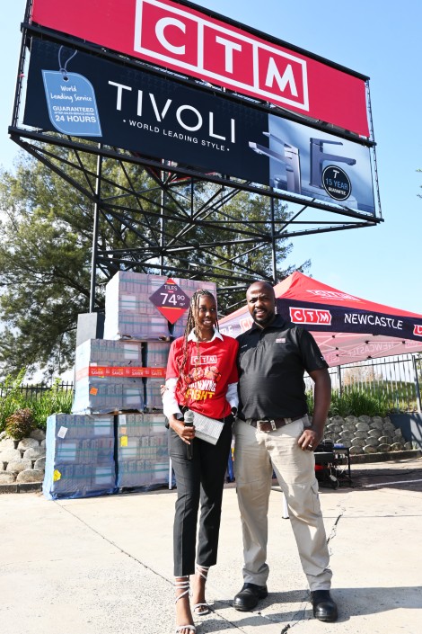 Two men are pictured standing outside the NEwcastle CTM store.